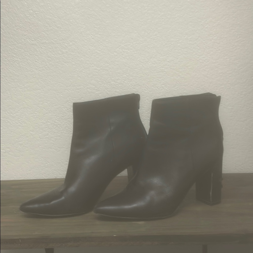 Black heeled leather booties